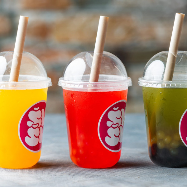 Three colorful bubble tea drinks
